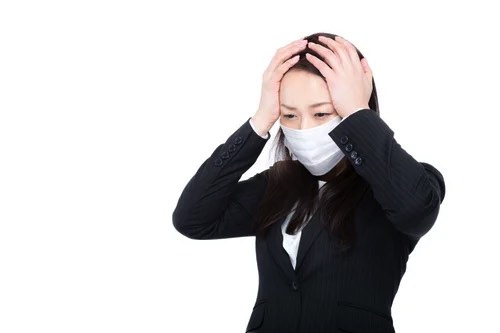 体調不良な女性